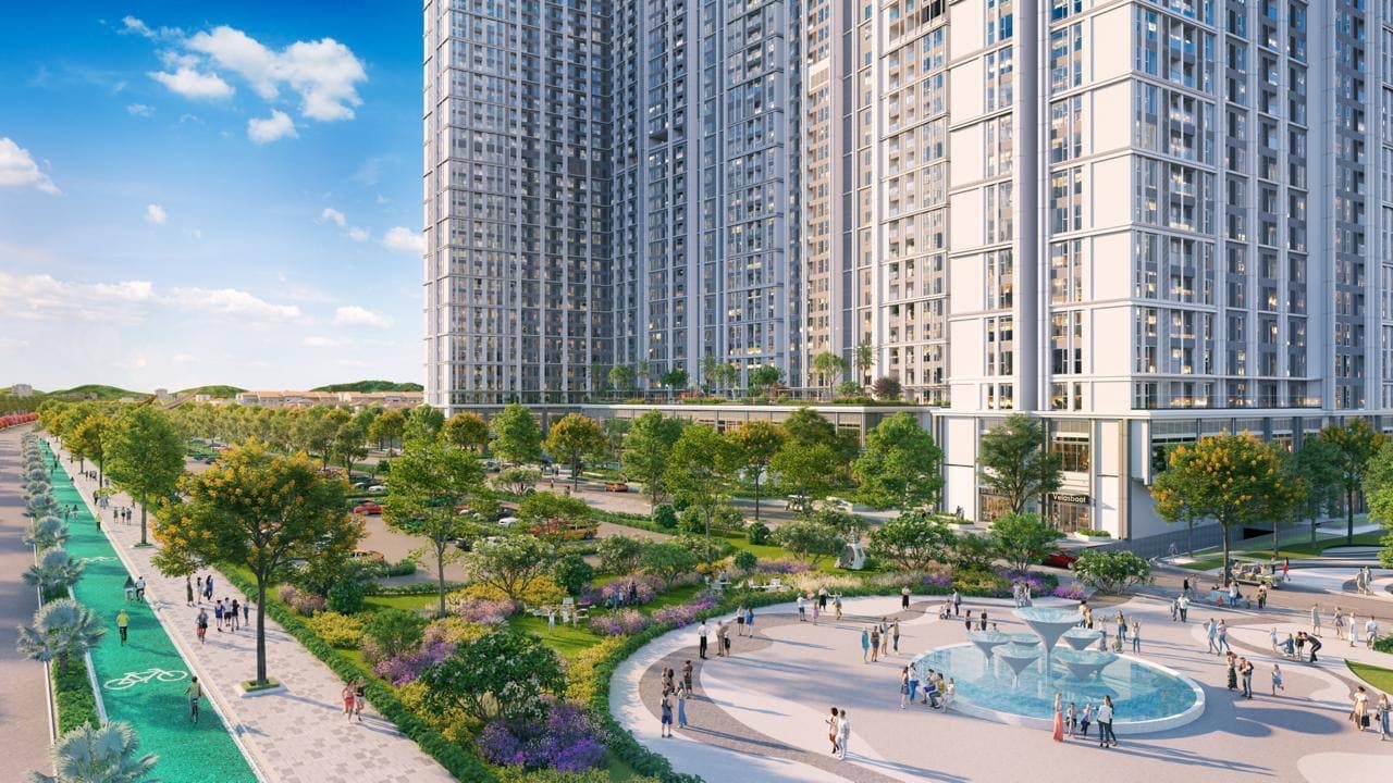 Tháp căn hộ cao tầng nhìn từ quảng trường nhạc nước với đại lộ cây xanh